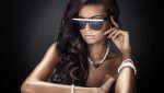 Woman in sunglasses posing with jewelry